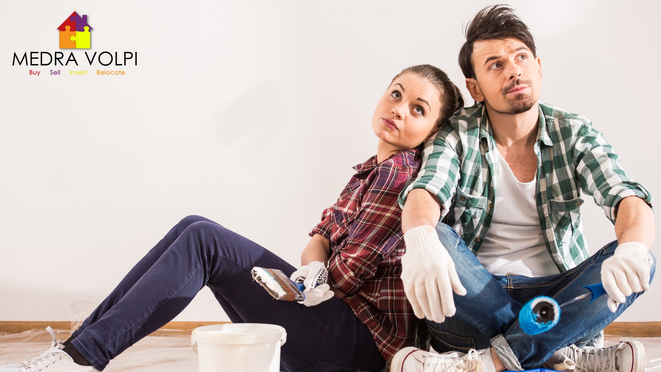 a couple deciding if they are going to repair their home or sell as is